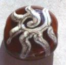 handmade glass lampwork bead, silvered ivory stringer on brown lentil